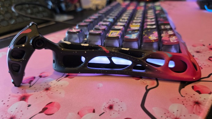 Side profile of the keyboard showing the funky mech-robot like legs.