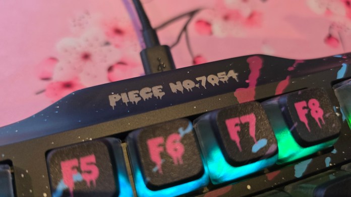 Unique number on the top of the keyboard in the middle. This one is numbered "piece No. 7054".