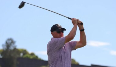 A male teeing off