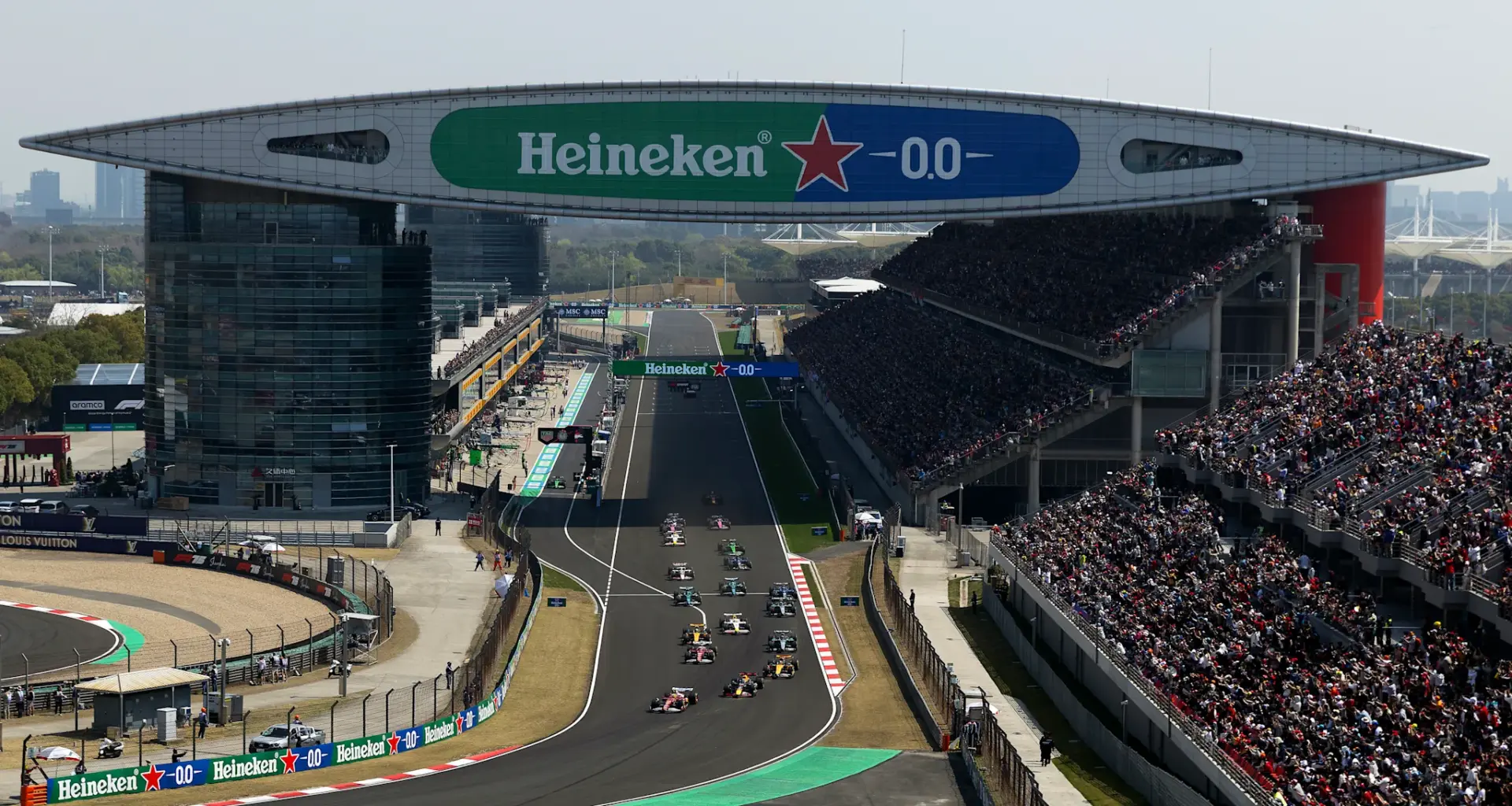 Ferrari's British driver Lewis Hamilton (front L) leads the pack at the start of the sprint race of