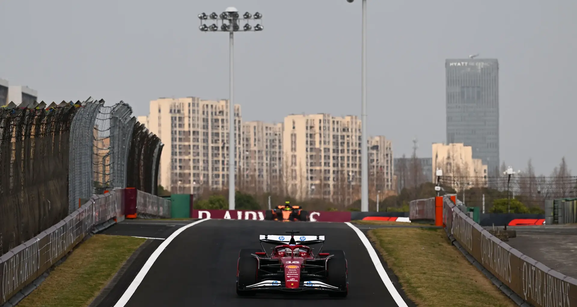 Ferrari's British driver Lewis Hamilton (front L) leads the pack at the start of the sprint race of