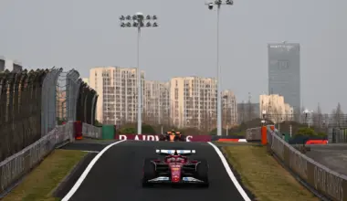 Ferrari's British driver Lewis Hamilton (front L) leads the pack at the start of the sprint race of