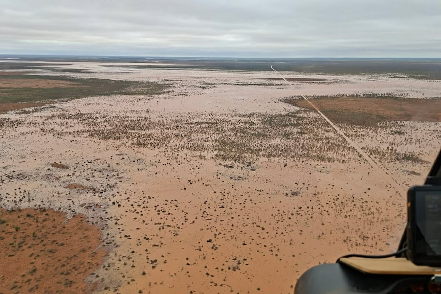 water covering red dirt, a birds eye view image from the helicopter