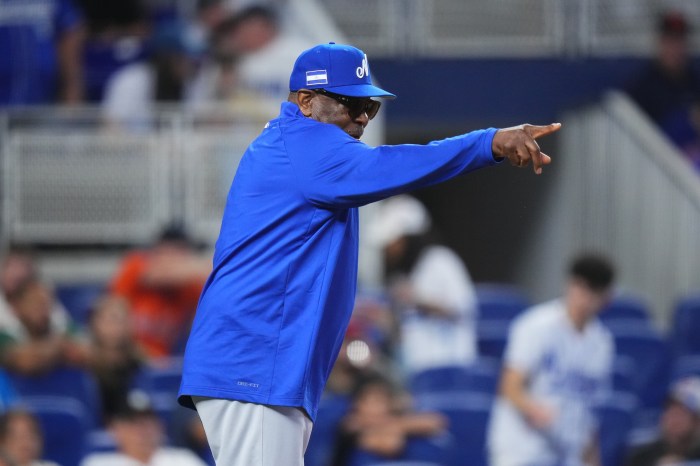 Dusty Baker points on the field.