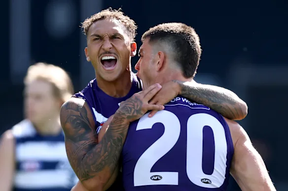 Shai Bolton of the Dockers is congratulated by Patrick Voss after kicking a goal.
