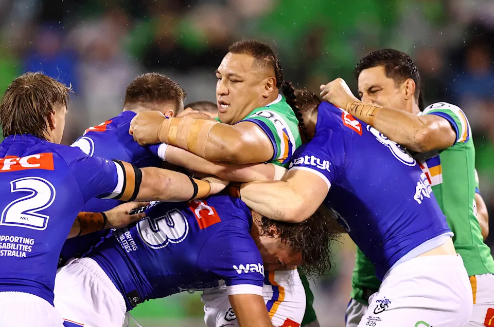 Seen here, Raiders NRL veteran Josh Papalii is tackled against the Bulldogs.