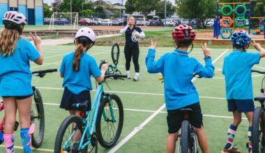 ARA Australian Cycling Team athletes Molly McGill and Ryan Elliott talk to students of St Peter Chanel Primary School as part of Ride2School Day and Brisbane Cycling Festival.