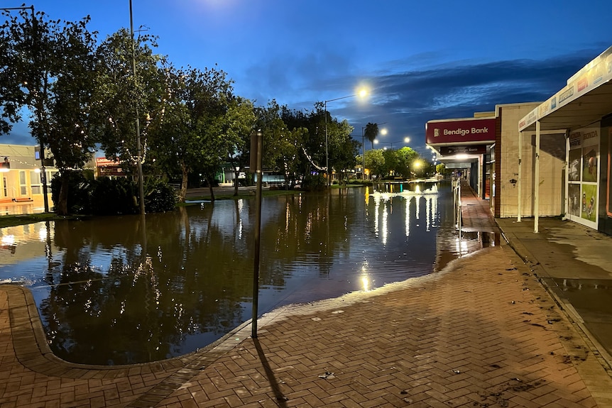 Floodwaters submerge part of the main street.