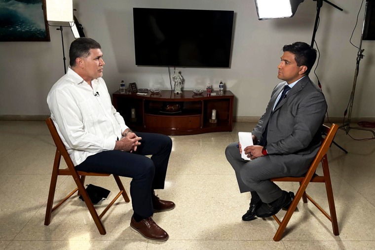Cuban Deputy Prime Minister Oscar Pérez-Oliva Fraga, left, in an interview with NBC News' George Solis.