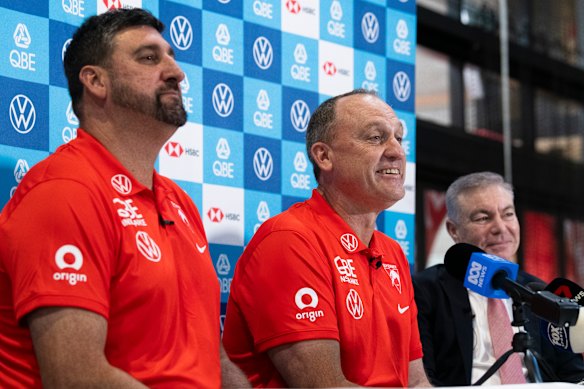 Longmire (centre), Dean Cox (left), and Andrew Pridham at Longmire’s final press conference as Swans coach before handing the reins to Cox.