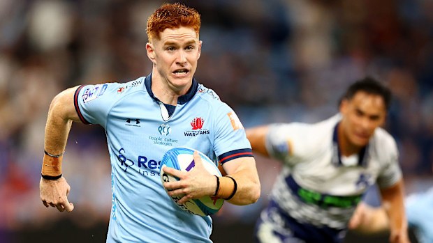 Sid Harvey of the Waratahs makes a line break.