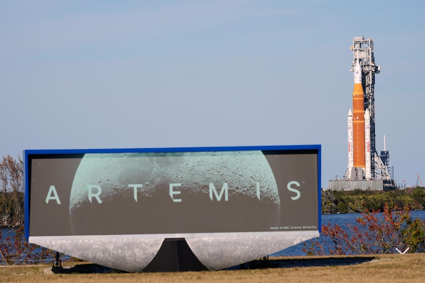 A sign saying artemis and a rocket behind.