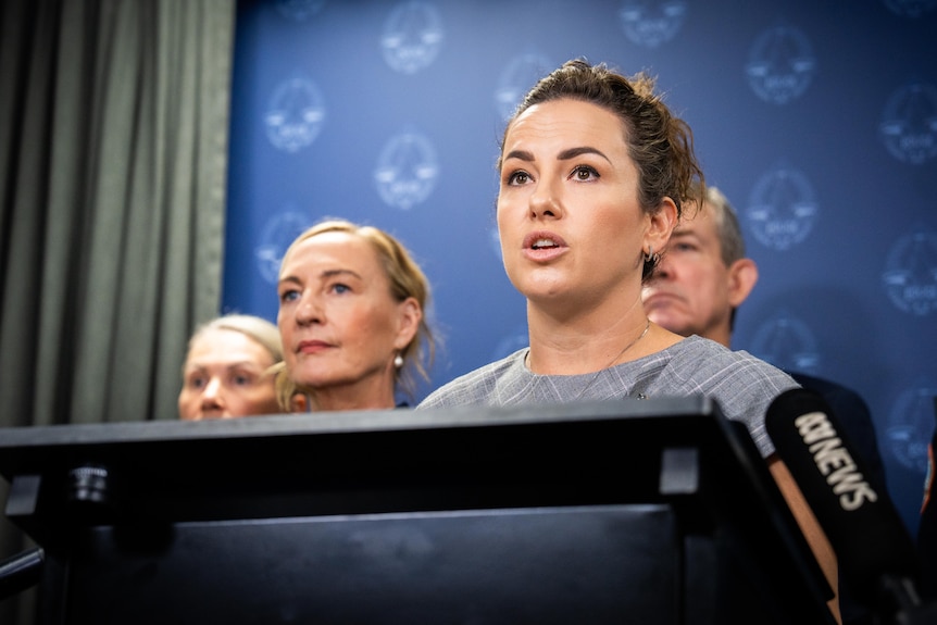 Lia Finocchiaro speaking at podium