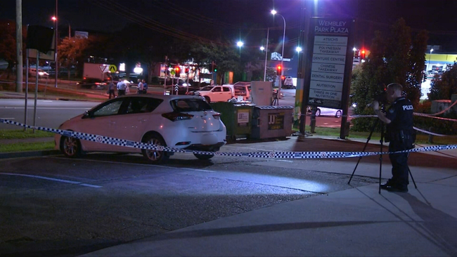 Officers arrived to find the 27-year-old on top of a car.