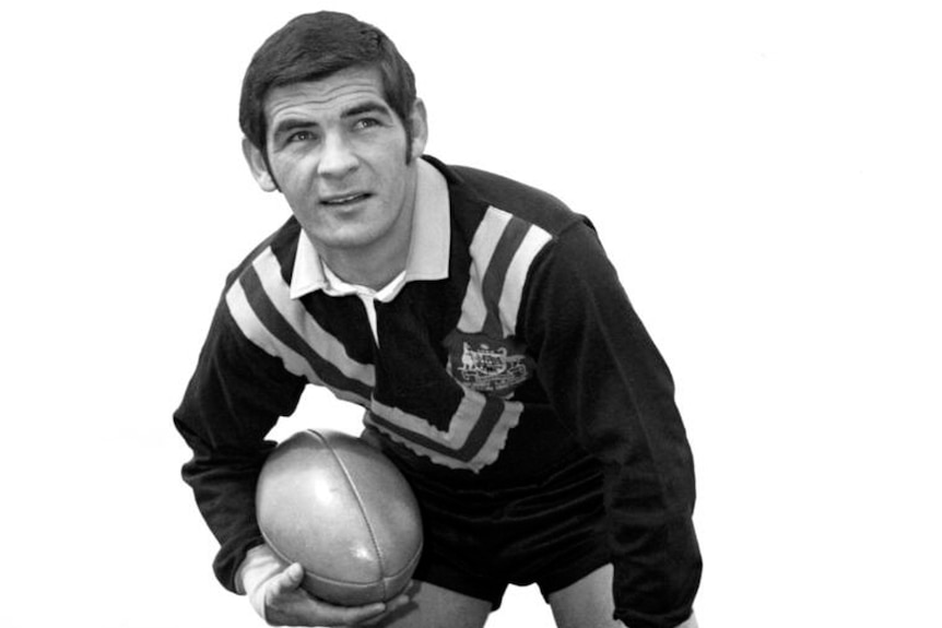 Ken Irvine pictured in the Australian team uniform while holding a ball in the 1960s.