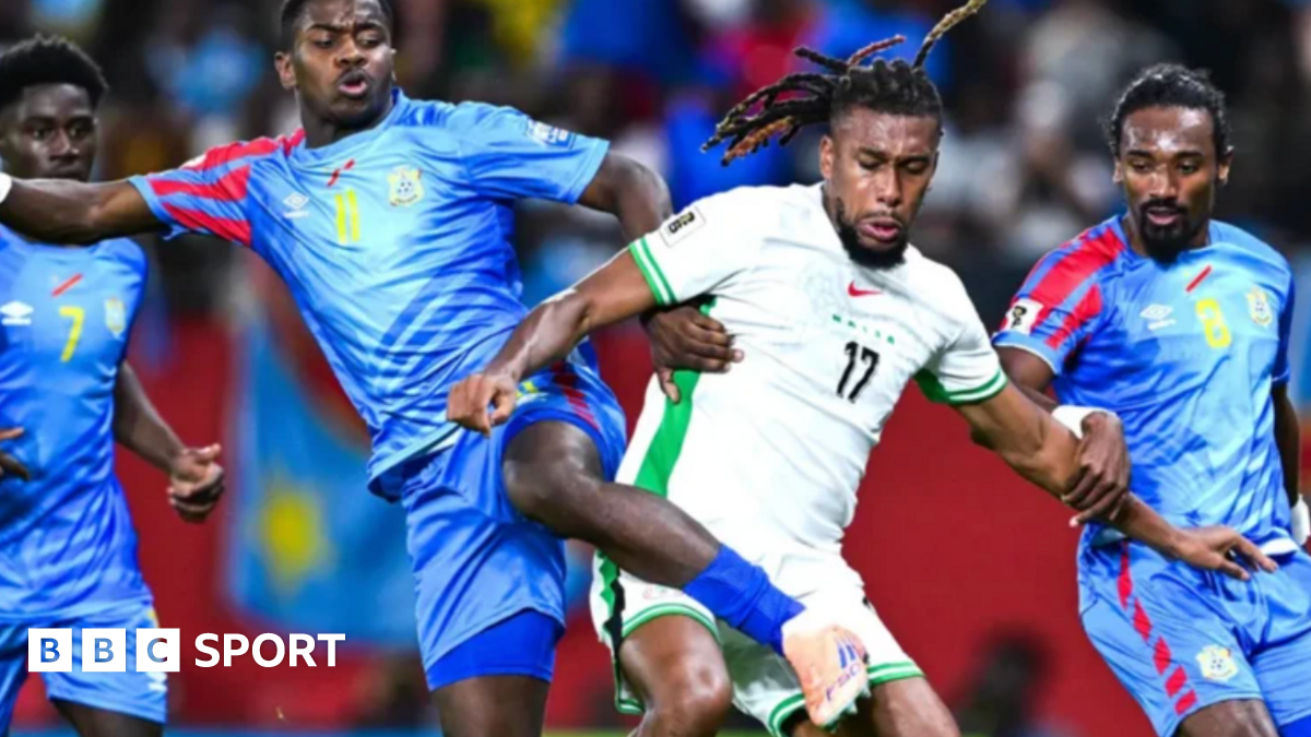 Dr Congo player challenging Nigeria's Chris Iwobi