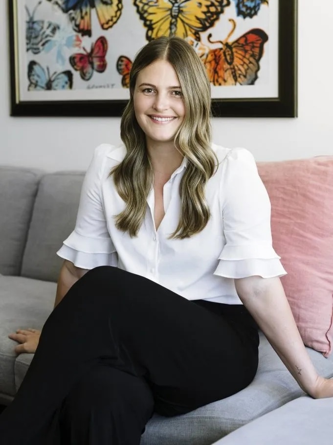 Lauren Gandini smiles at the camera.