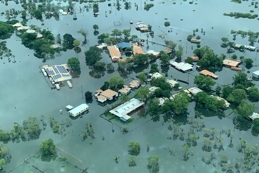 An aerial photo of a small community, with several homes partially underwater.