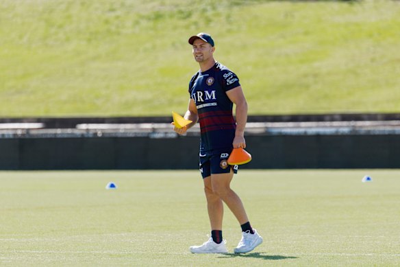 Kieran Forans lays out training markers at 4 Pines Park on Sunday.