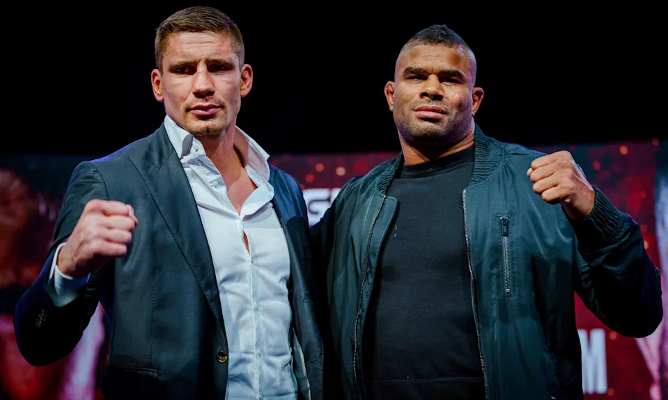 Dutch kickboxer Rico Verhoeven (L) poses with Dutch kickboxer Alistair Overeem during a press presentation ahead of their first fight in Utrecht on September 21, 2021. - The boxers will compete for the world title in October during Glory 79 in Gelredome in Arnhem. It is the first time that the fighters see each other face to face. - Netherlands OUT (Photo by Marco de Swart / ANP / AFP) / Netherlands OUT (Photo by MARCO DE SWART/ANP/AFP via Getty Images)