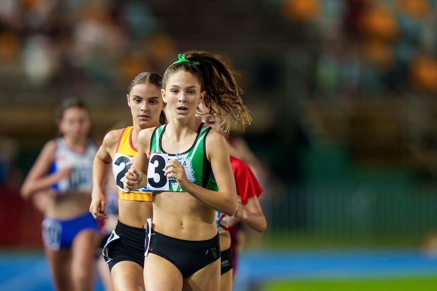 Ellie runs mid race.