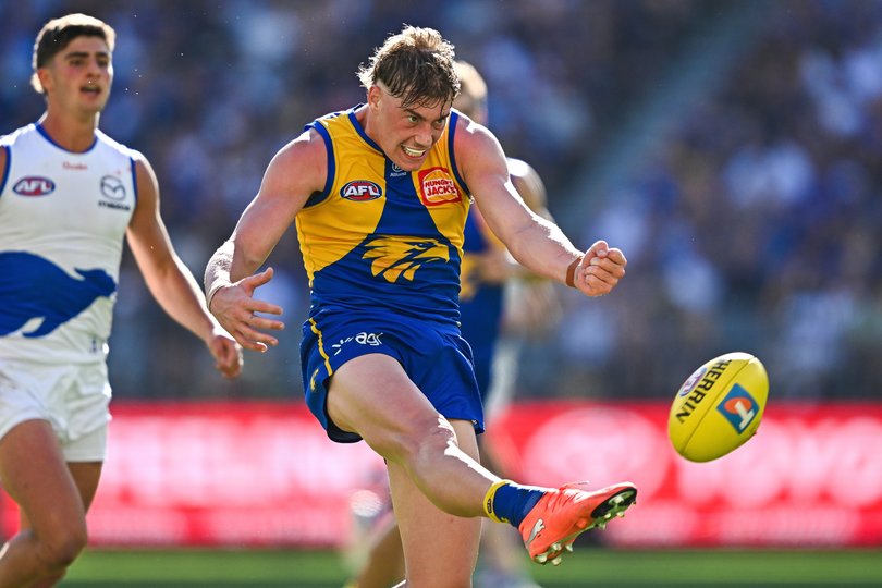 Harley Reid of the Eagles kicks the ball.