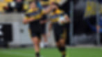 Josh Moorby congratulates Fehi Fineanganolo on one of his three tries in the Hurricanes win over the Reds PHOTO: LINTOTT PHOTOGRAPHY