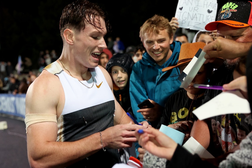 Lachlan Kennedy signs autographs at the Maurie Plant Meet.