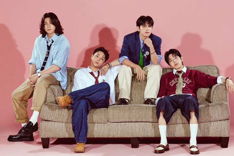 Four guys sitting on the couch.