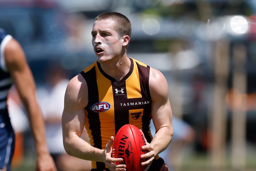 Josh Ward in possession of the football