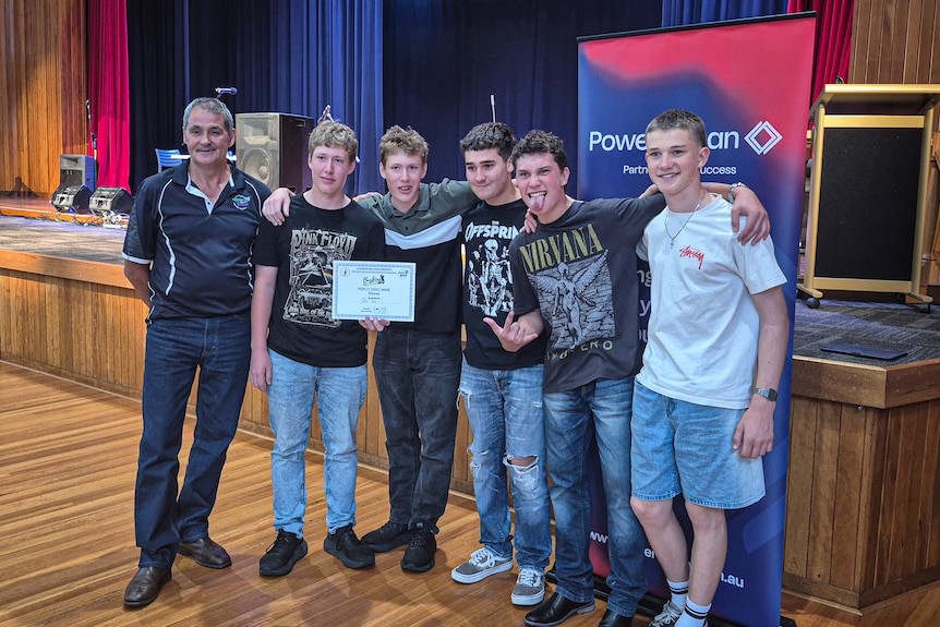 Young boys posing with certificate