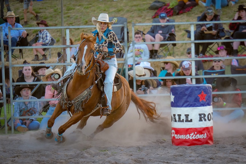 A woman riding a horse