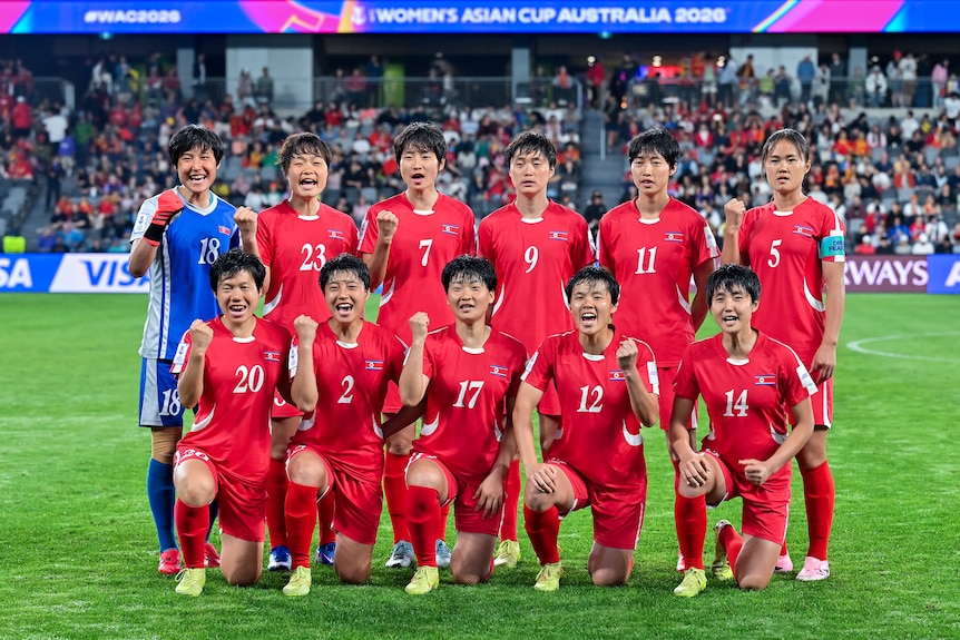 The North Korean team pose for a photo after a match