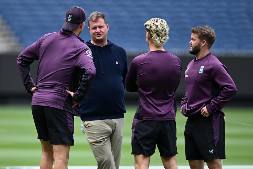 Rob Key speaks to England players