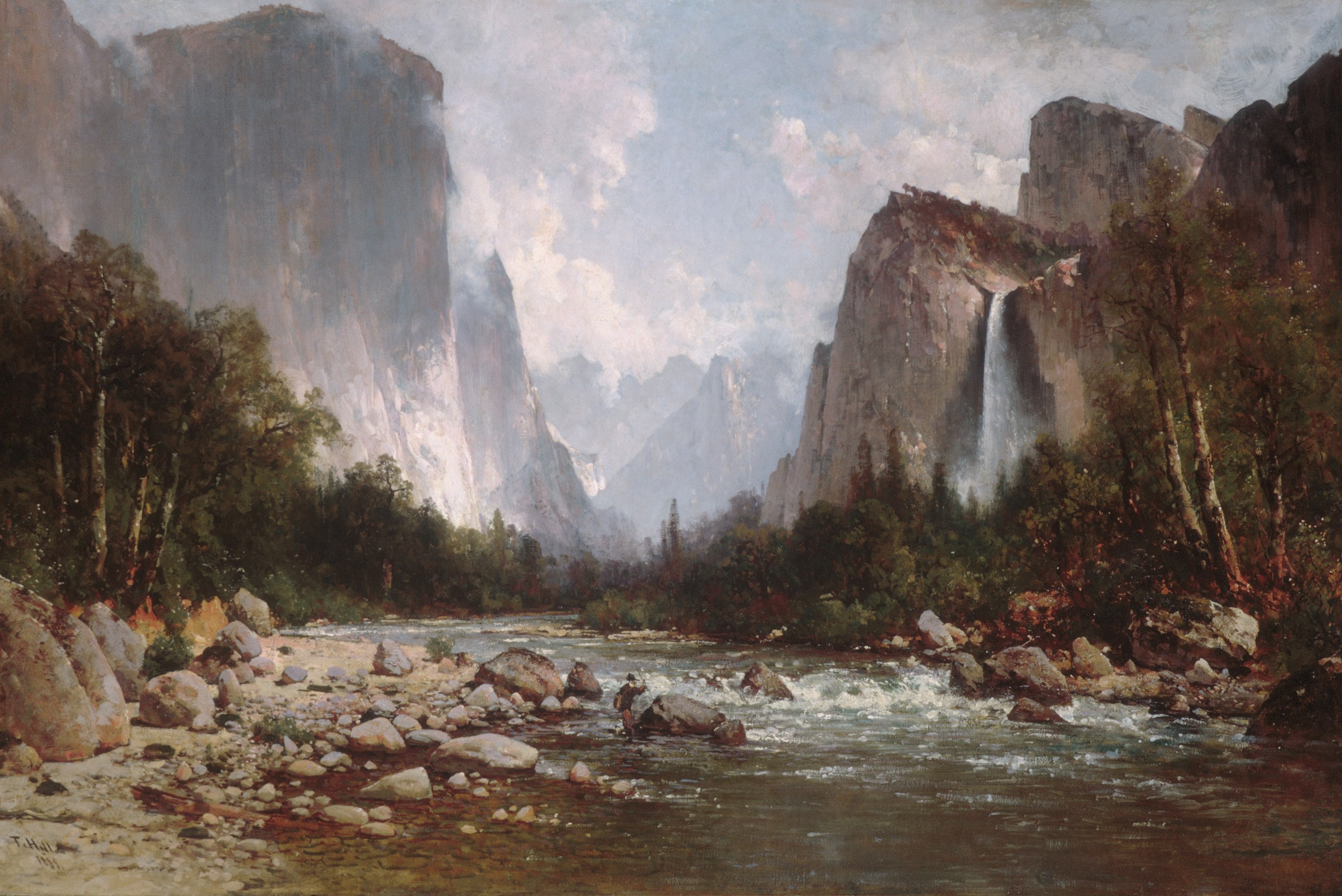 An 1885 painting of a tree-lined river running through a valley, rocky crags rising on either side.