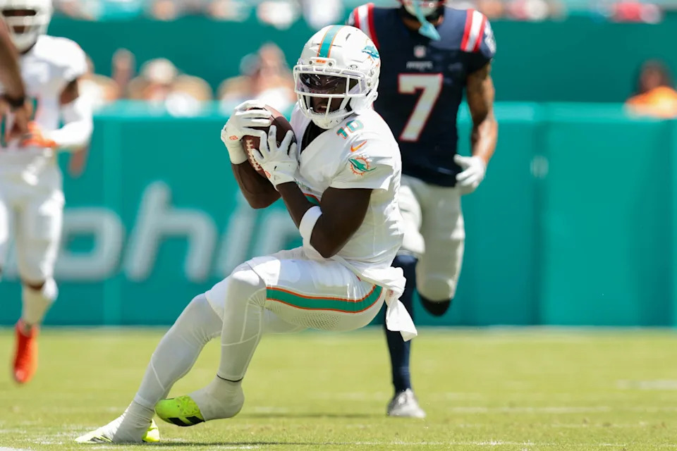 Sep 14, 2025; Miami Gardens, Florida, USA; Miami Dolphins wide receiver Tyreek Hill (10) catches the football against the New England Patriots during the second quarter at Hard Rock Stadium. Mandatory Credit: Sam Navarro-Imagn Images