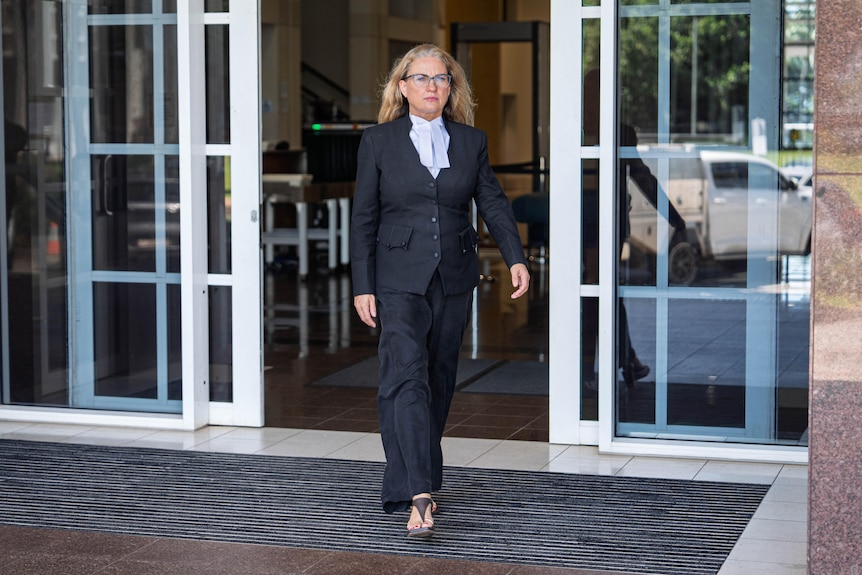 A woman walking out of the NT Supreme Court. 