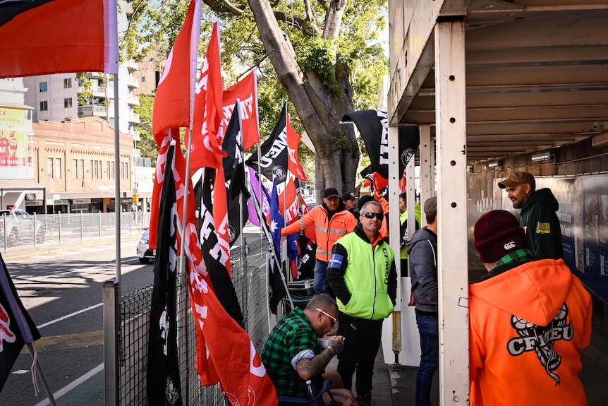Union members protest next to a road