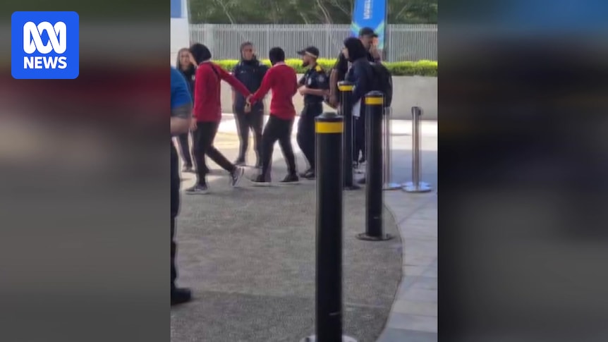 Iranian football player led onto bus from hotel