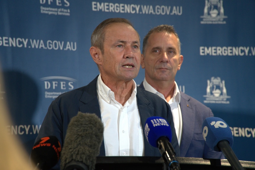 Roger Cook is speaking to the media. 