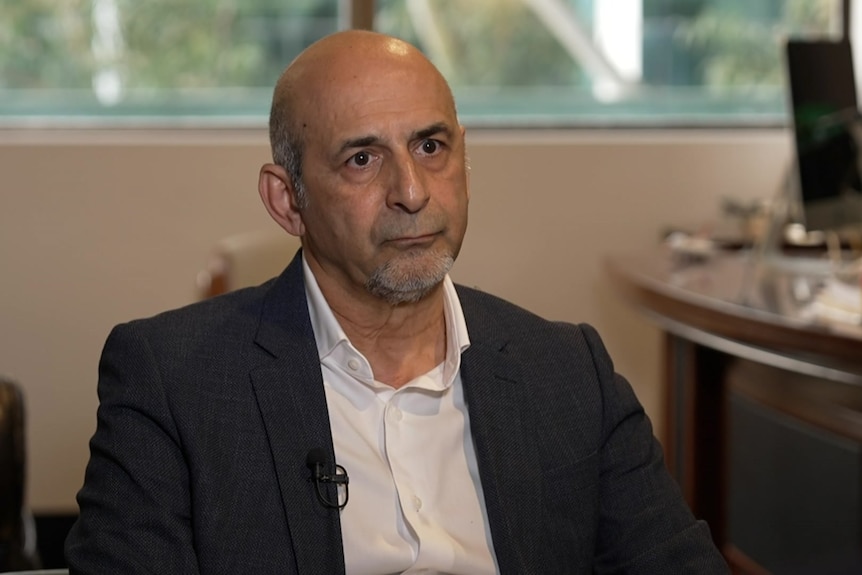 Siamak Ghahreman looks at the camera with a serious expression.