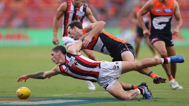 Max Hall and Jack Buckley contest the footy.