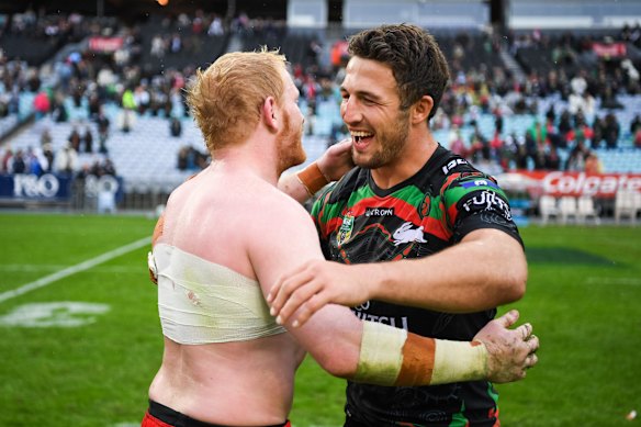 Dream team: James Graham and Sam Burgess embrace after an NRL game.