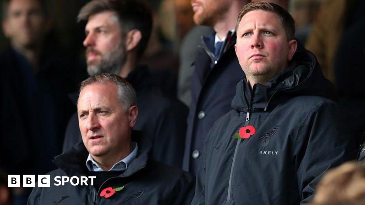 Neil Adams and Ben Knapper in the stands at Carrow Road