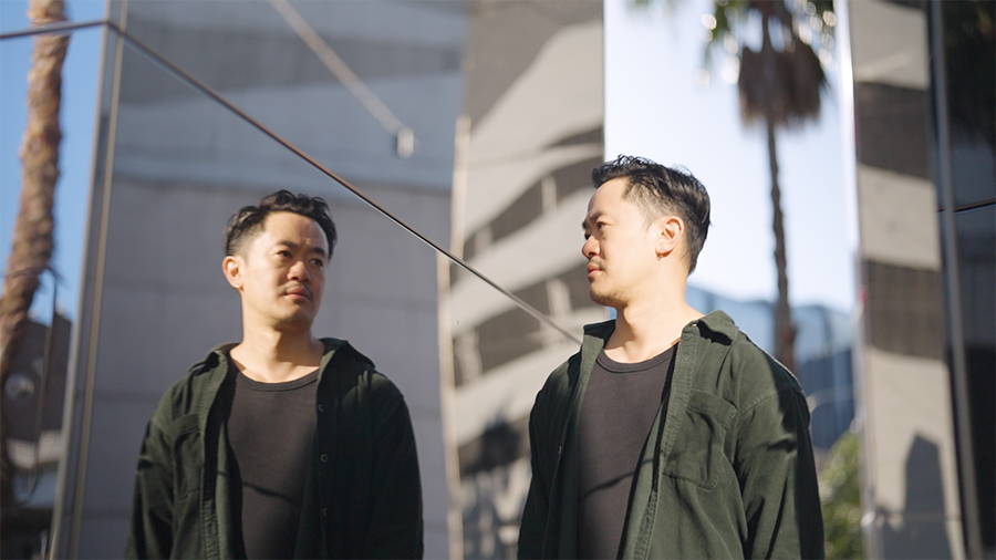 Benjamin Law contemplates his reflection in the mirrorÂ