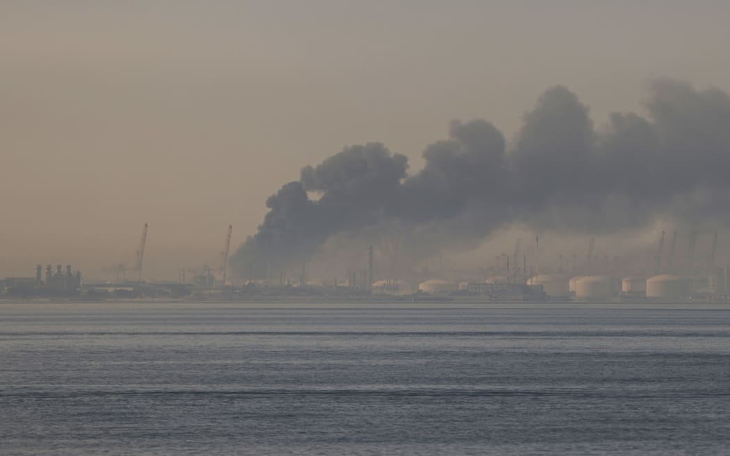 A plume of smoke rises from the port of Jebel Ali following a reported Iranian strike in Dubai on March 1, 2026. Fresh blasts were heard across the Gulf cities of Dubai, Doha and Manama on Sunday morning after a day of Iran strikes in the region in retaliation for US and Israeli attacks. (Photo by Fadel SENNA / AFP)