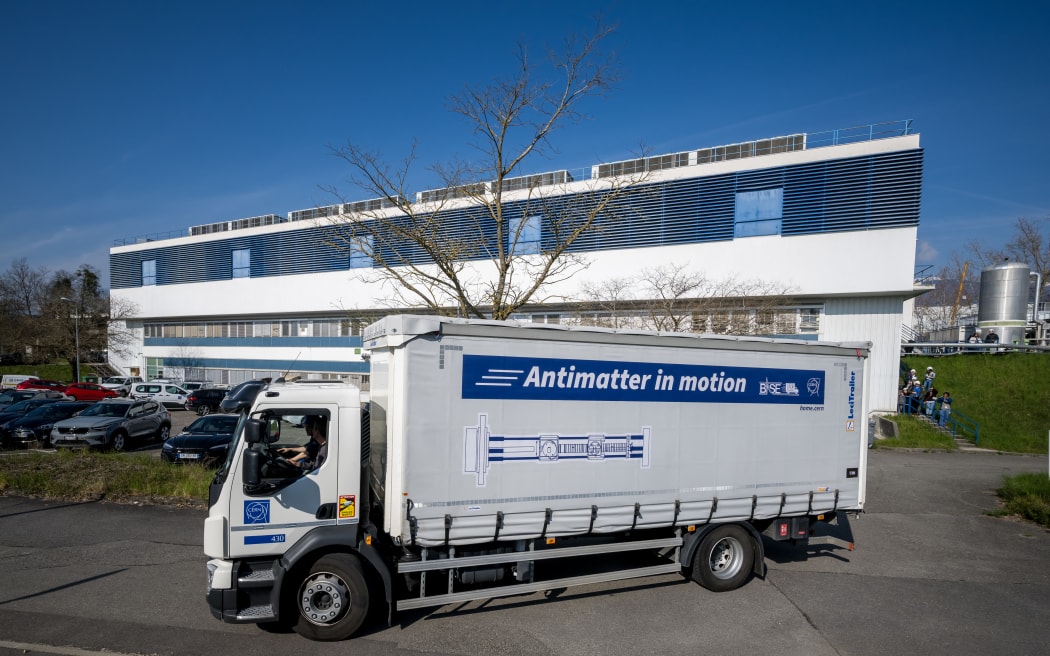 A truck during a successful test drive of the world’s first antimatter delivery system, conducted by CERN’s BASE-STEP experiment, which transported a cloud of 92 antiprotons by road across the organization’s main site using a specially designed portable cryogenic Penning trap device, in Meyrin near Geneva, on March 24, 2026. The ultimate goal is to transport antiprotons to facilities such as Heinrich Heine University in Dusseldorf, where a calmer magnetic environment would enable measurements with greater precision. Such advances could provide crucial insights into one of the fundamental questions of physics: why matter dominates over antimatter in the universe. (Photo by Fabrice COFFRINI / AFP)