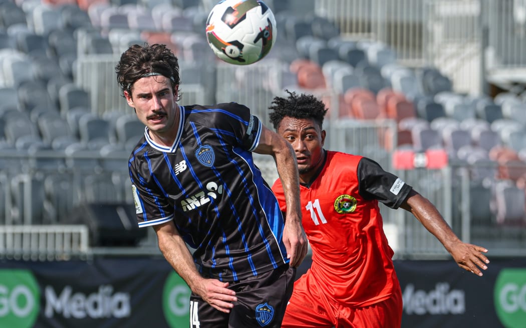 Auckland FC's Liam Gillion and PNG Hekari FC's Rex Naime at Santos National Football Stadium, Papua New Guinea.
