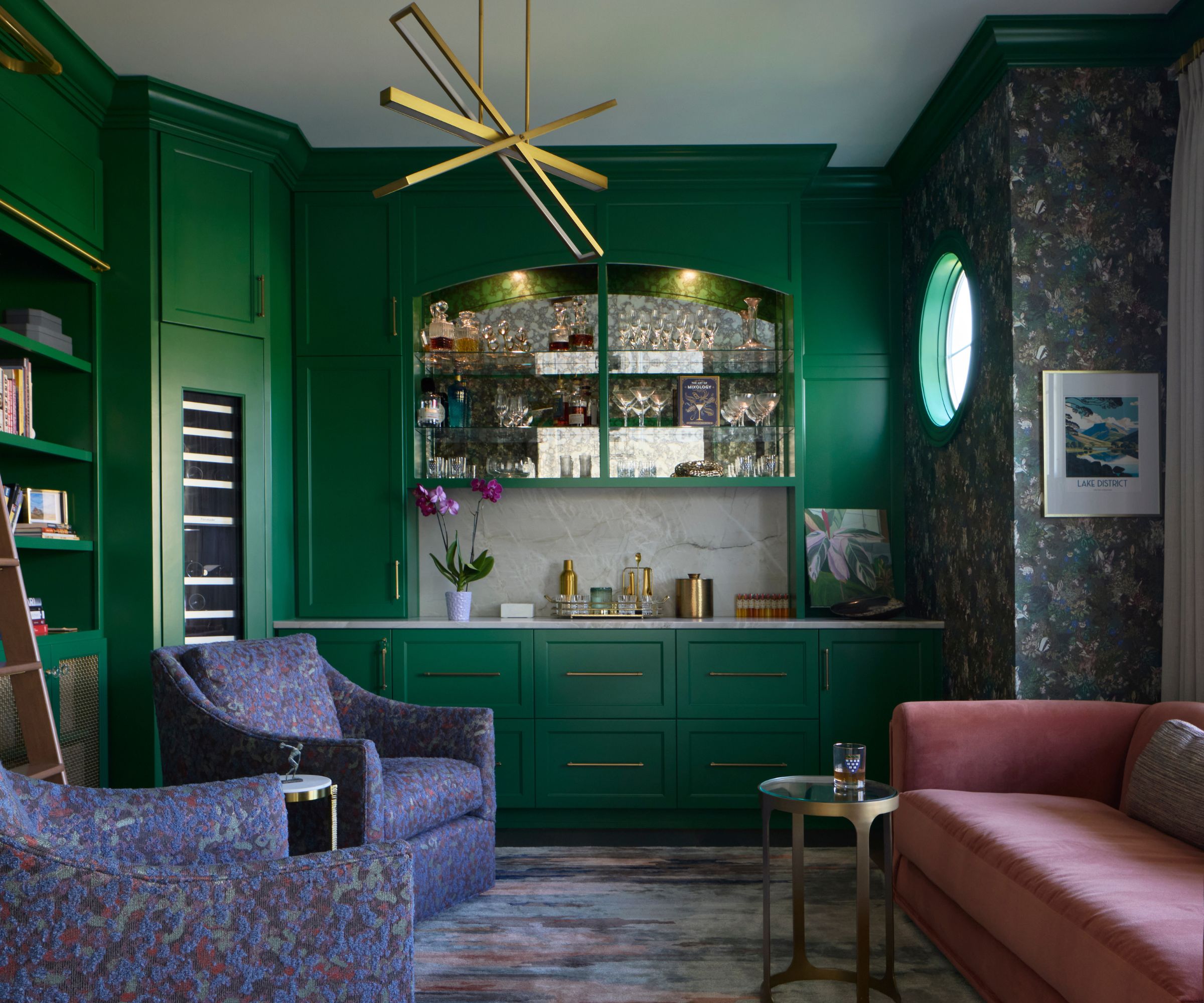 Home bar room with bold green millwork