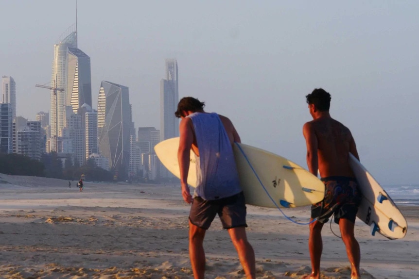 two men with surfboards